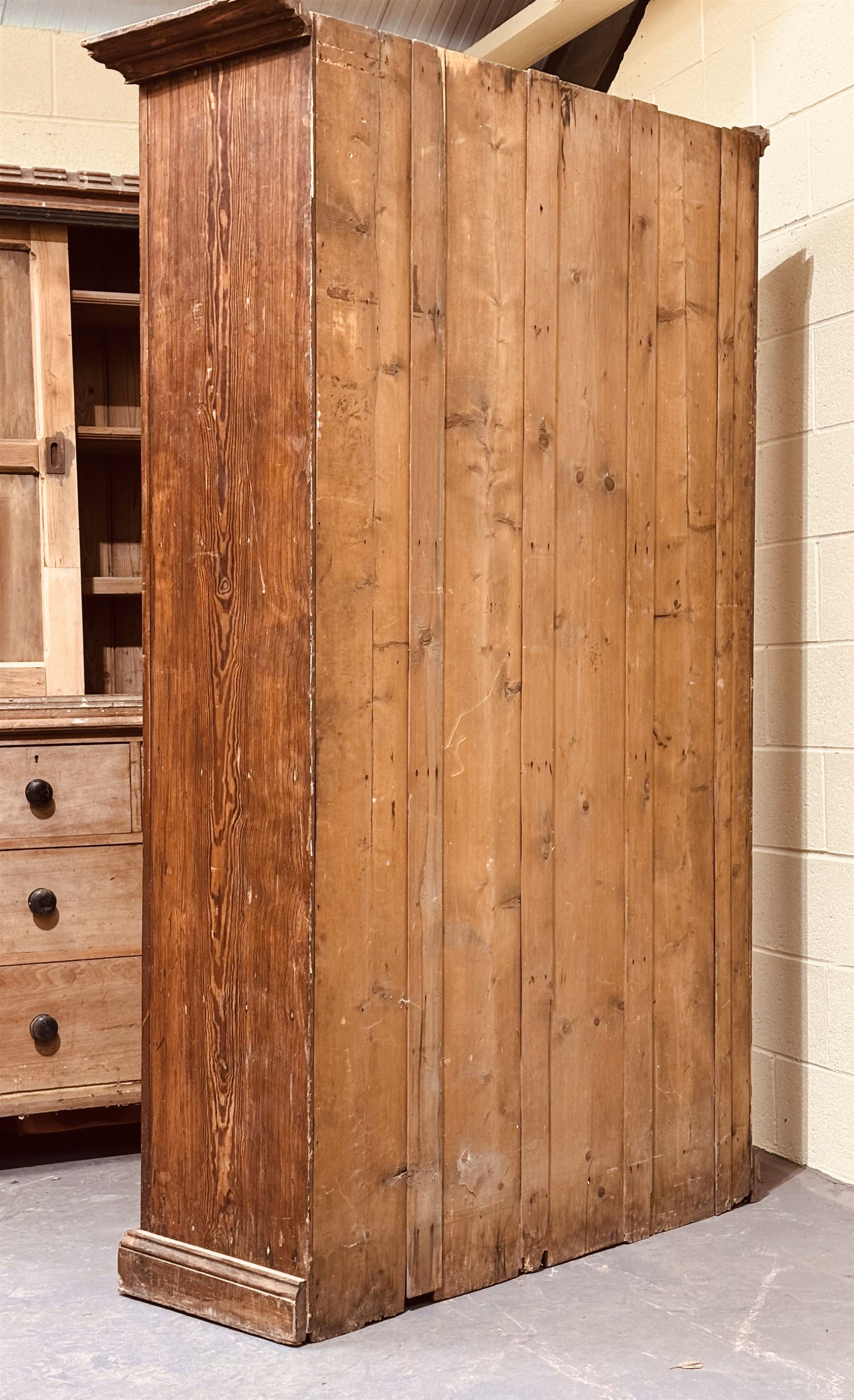 Early 20th century pitch pine school cupboard, the four panelled doors enclosing shelves, raised on a skirted base. H219cm, W128cm, D46cm.  - COLLECTION BY APPOINTMENT FROM: The White House, Thirsk Road, Easingwold, York, YO61 3NF - CALL 01723 507111 TO ARRANGE