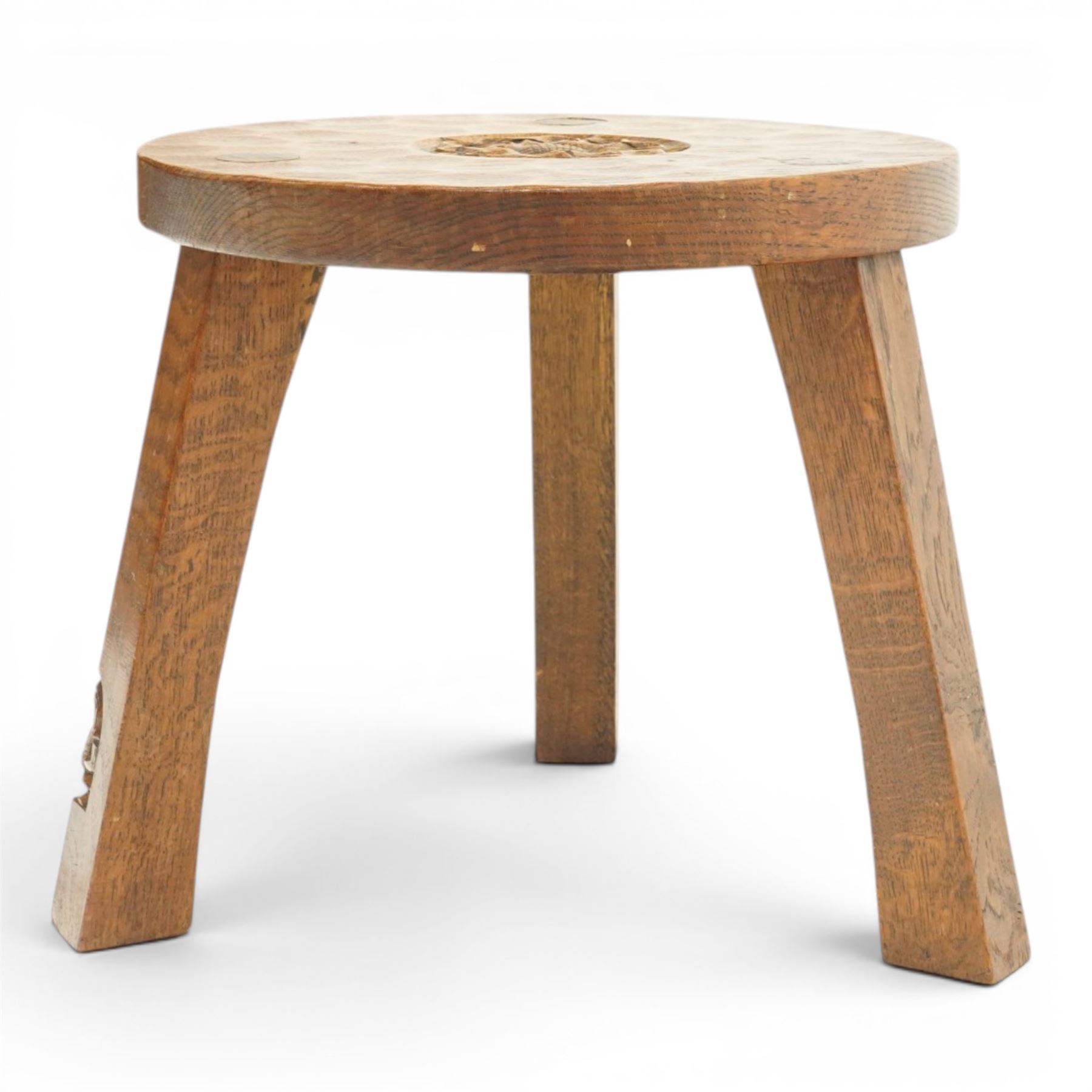 Gnomeman - circular adzed oak stool with carved Yorkshire Rose top, raised on three shaped supports carved with gnome signature, by Thomas Whittaker, Littlebeck, Whitby
