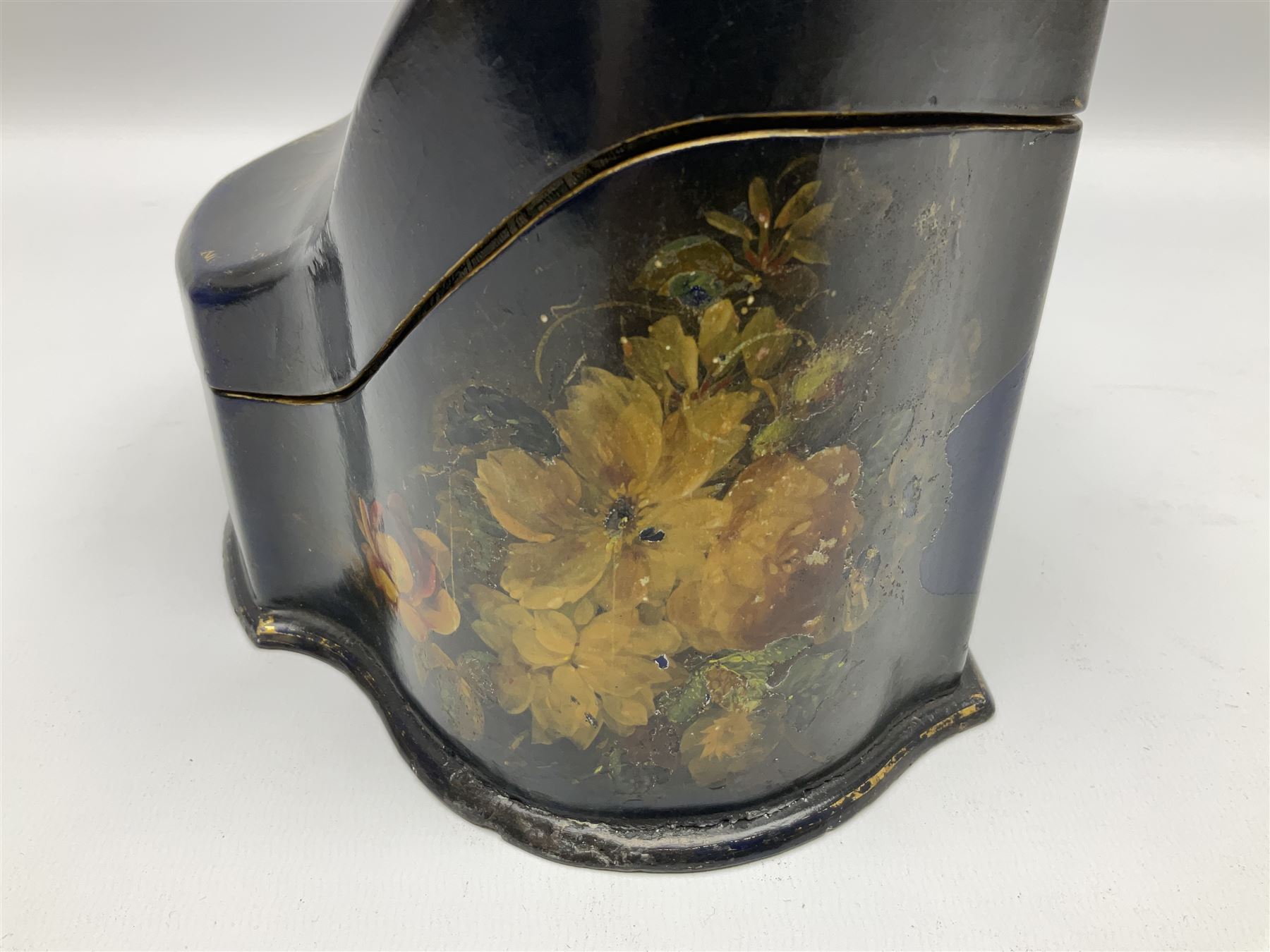 Victorian papier-mâché stationary box, of rounded wedge form with mother of pearl escutcheon, the hinged and curved cover and sides hand painted with floral sprays, opening to reveal a lined and fitted interior, H15cm L22cm D16cm