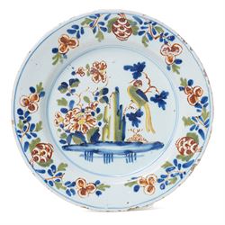 18th Century English Delft plate, probably Lambeth c1750, painted with a parrot on a branc...