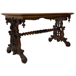 Victorian figured walnut stretcher side table, moulded rectangular top with figured book-matched veneers, shaped and pierced end supports carved with foliage and fruit, out-splayed feet carved with scrolled foliage, united by a spiral turned stretcher 