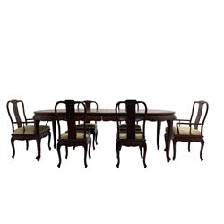 Mid to late 20th century Chinese hardwood extending dining table, two additional leaves, shaped apron carved with foliate scrolls, leaf carved cabriole supports (W246cm, H78cm, D117cm), and set six (4+2) dining chairs with shaped cresting rails over carved splats