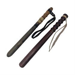Two wooden truncheon with turned grips and leather straps, L40cm