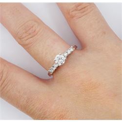 18ct white gold diamond ring, single stone round brilliant cut diamond of approx 0.50 carat, with diamond set shoulders, stamped 750