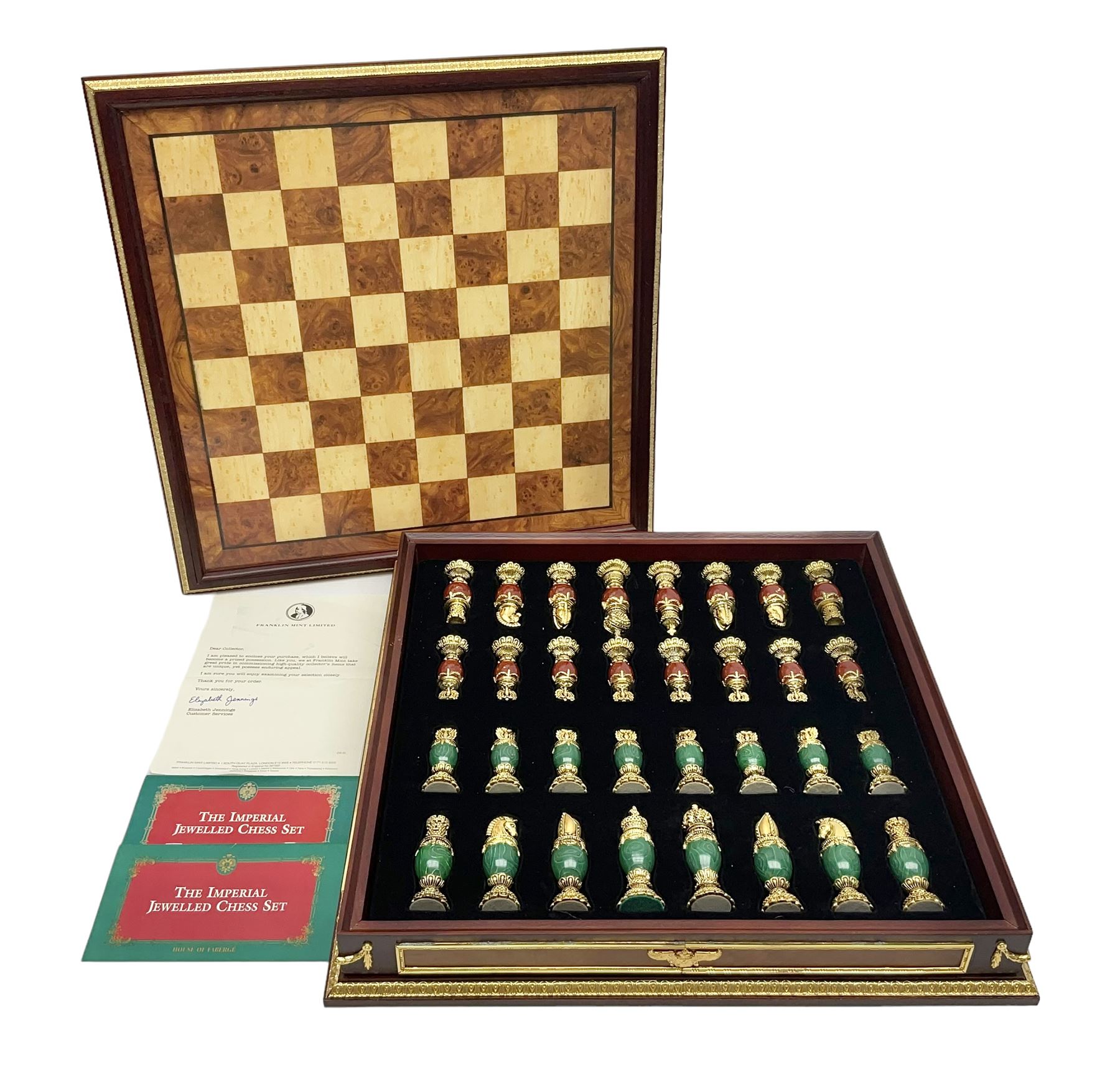 Franklin Mint House of Faberge 'The Imperial Jewelled Chess Set', to include set of chess pieces with malachite finish and a set with carnelian finish and a hardwood chess board