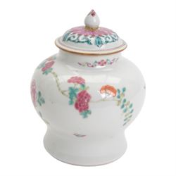 Chinese Qianlong period famille rose porcelain jar and cover, of small squat baluster form with domed cover and knop finial, finely enamelled in the famille rose palette with peony blooms, flowering prunus and bamboo issuing from pierced rockwork, upon a white glazed ground, with underglaze blue double ring mark beneath, H15cm

Provenance: From the collection of Andrew Chichester Everitt.
