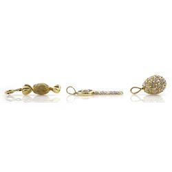Three 9ct gold charms including sapphire and diamond key, diamond openwork egg and textured and polished sweet, all stamped or hallmarked