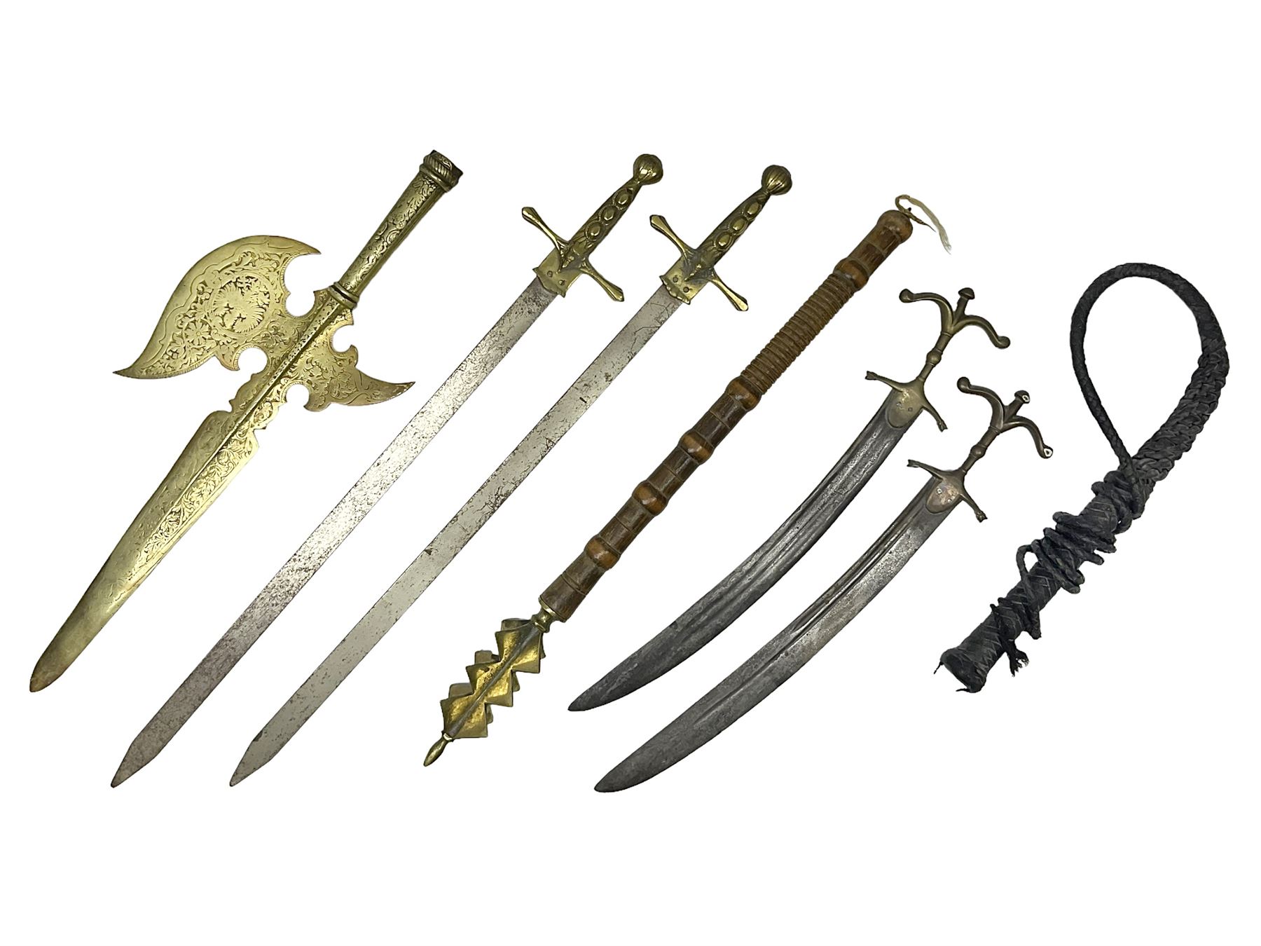 Near pair of short swords each with slightly curving 41cm fullered steel blade and all brass H-shaped hilt L52cm overall; plaited black leather whip; and reproduction pair of brass hilted swords, brass halberd blade and mace (7)