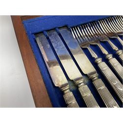 Victorian silver plated dessert set by Elkington & Co for twelve place settings, each reeded handle with vacant cartouche, each with Elkington & Co mark, date letter for 1861, and registration lozenge, contained within a mahogany case with vacant brass cartouche to the hinged cover, opening to reveal a Royal blue baize lined interior with removable tray, case H6cm W29.5cm D26.5cm