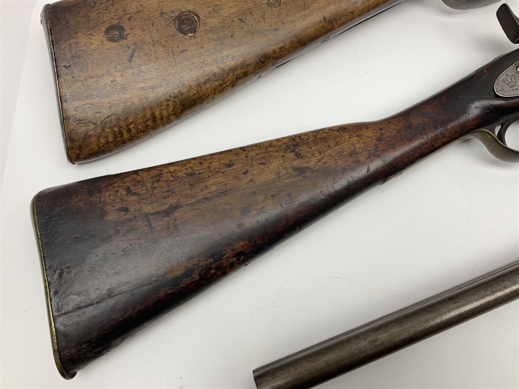 19th century Indian .577 Enfield muzzle loading rifle, proofed for 26-bore, the 98.5cm barrel with three barrel bands and later ram rod L140cm overall; 19th century Belgian side-by-side double barrel percussion shotgun, approximately 20-bore, with 74cm barrels and studded walnut stock, lock plate marked 'Liege 1868' and 'V. Gulikers-Maquinay' L117cm overall; and another side-by-side double barrel shotgun by Smythe with underlever opening (3)
