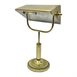  Brass bankers lamp, with a a brass cased shade over brass shades, raised upon a circular base, H34cm