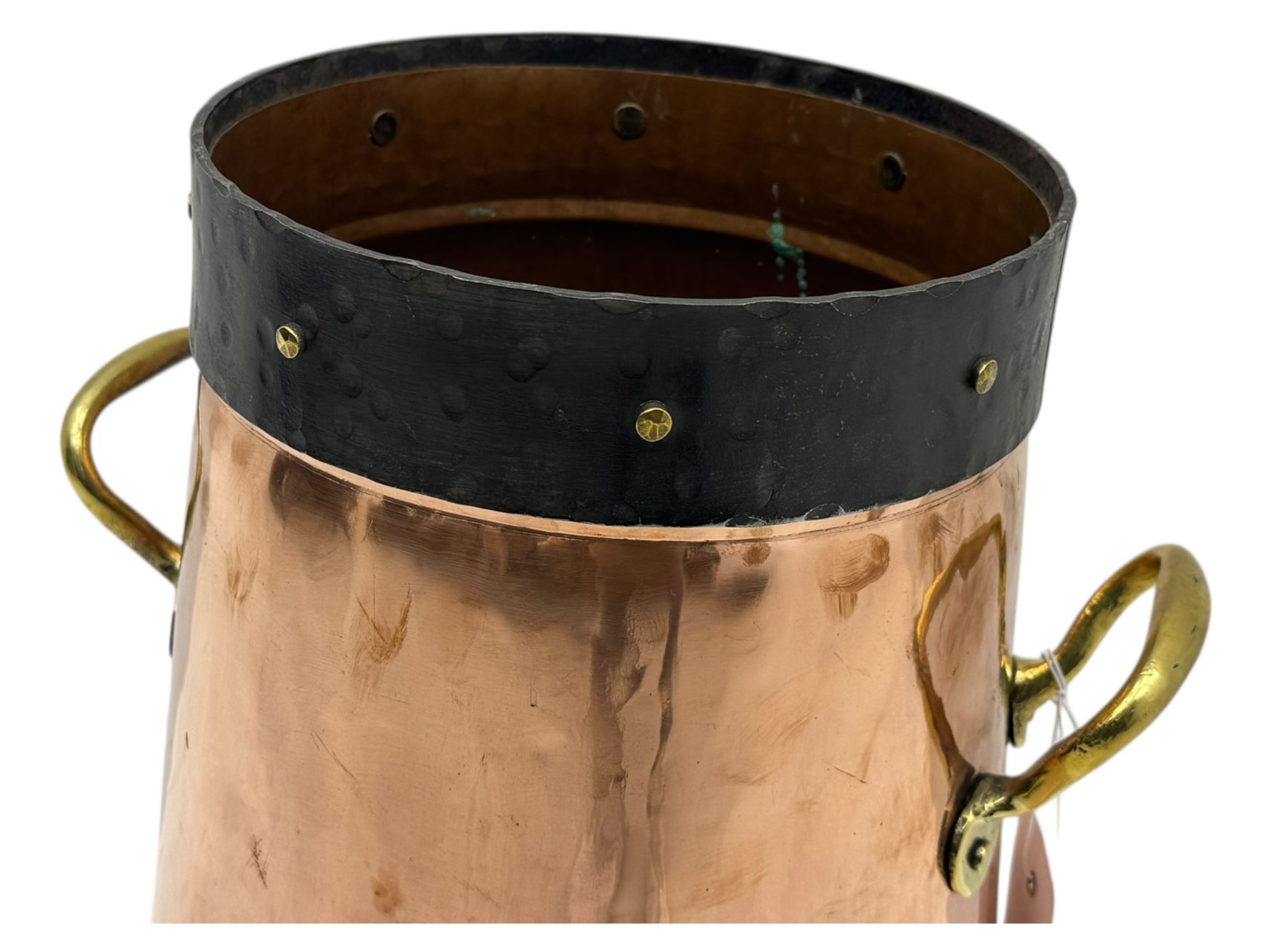 20th century copper milk churn, of tapering cylindrical form with applied brass twin handles and darkened banded rim and base
