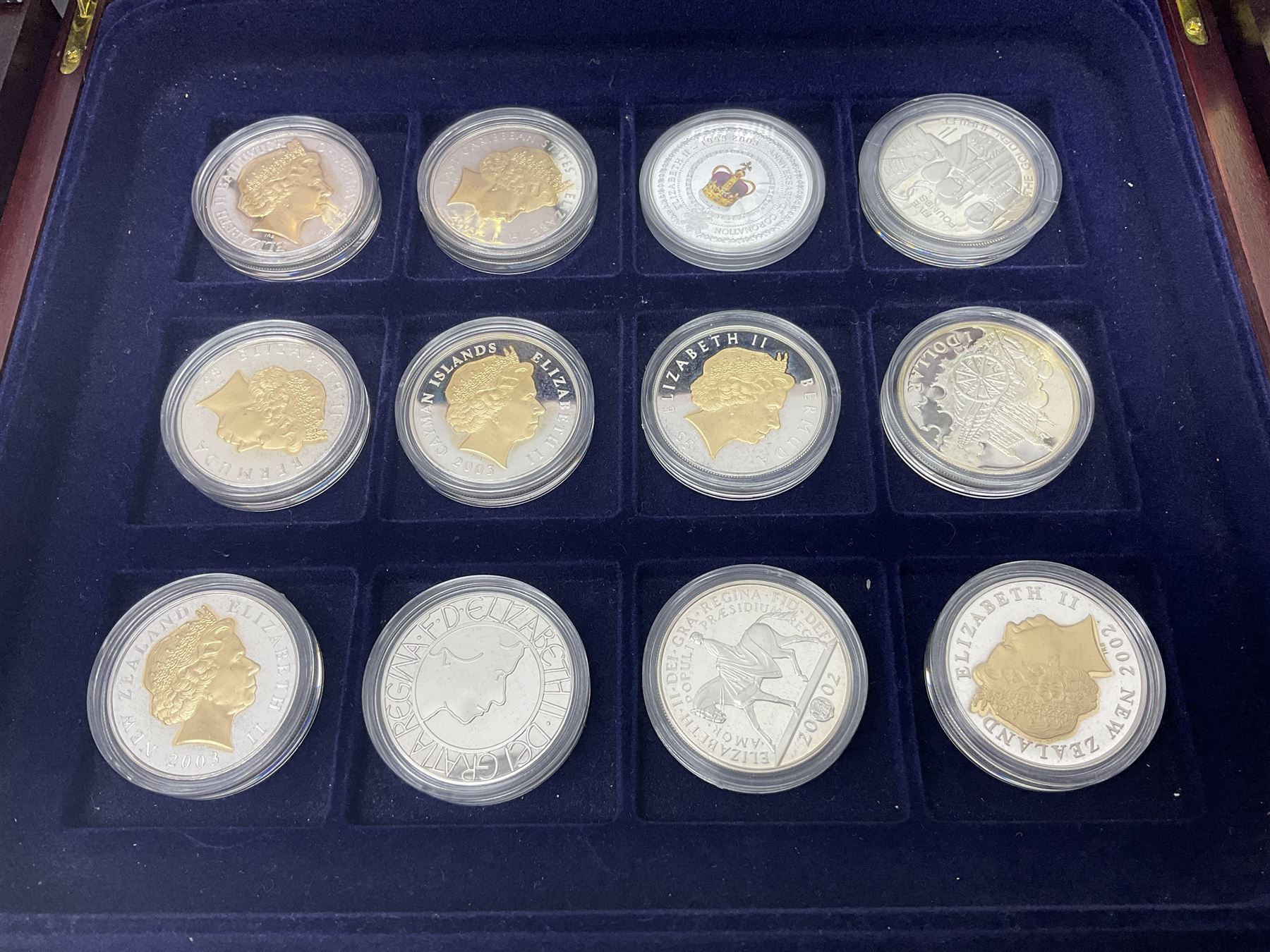 Single owner lifetime collection of mostly commemorative modern World coins with gold, silver and base metal examples, including two Queen Elizabeth II Bailiwick of Guernsey twenty-five pound gold coins 'The 1999 Royal Wedding' and '100th Anniversary of the End of the Victorian Era' 2001 each in 24 carat gold weighing 7.81 grams with certificates, silver coins commemorating the Millennium 2000 including Guyana sterling silver proof two-thousand dollars, Fiji sterling silver proof five dollars etc, silver coins from the Queen Elizabeth II Golden Jubilee Collection dated either 2002 or 2003 from Great Britain and the Commonwealth countries, United Kingdom commemorative crowns in card folders, The Royal Mint United Kingdom 1997 proof coin set in red folder without certificate etc