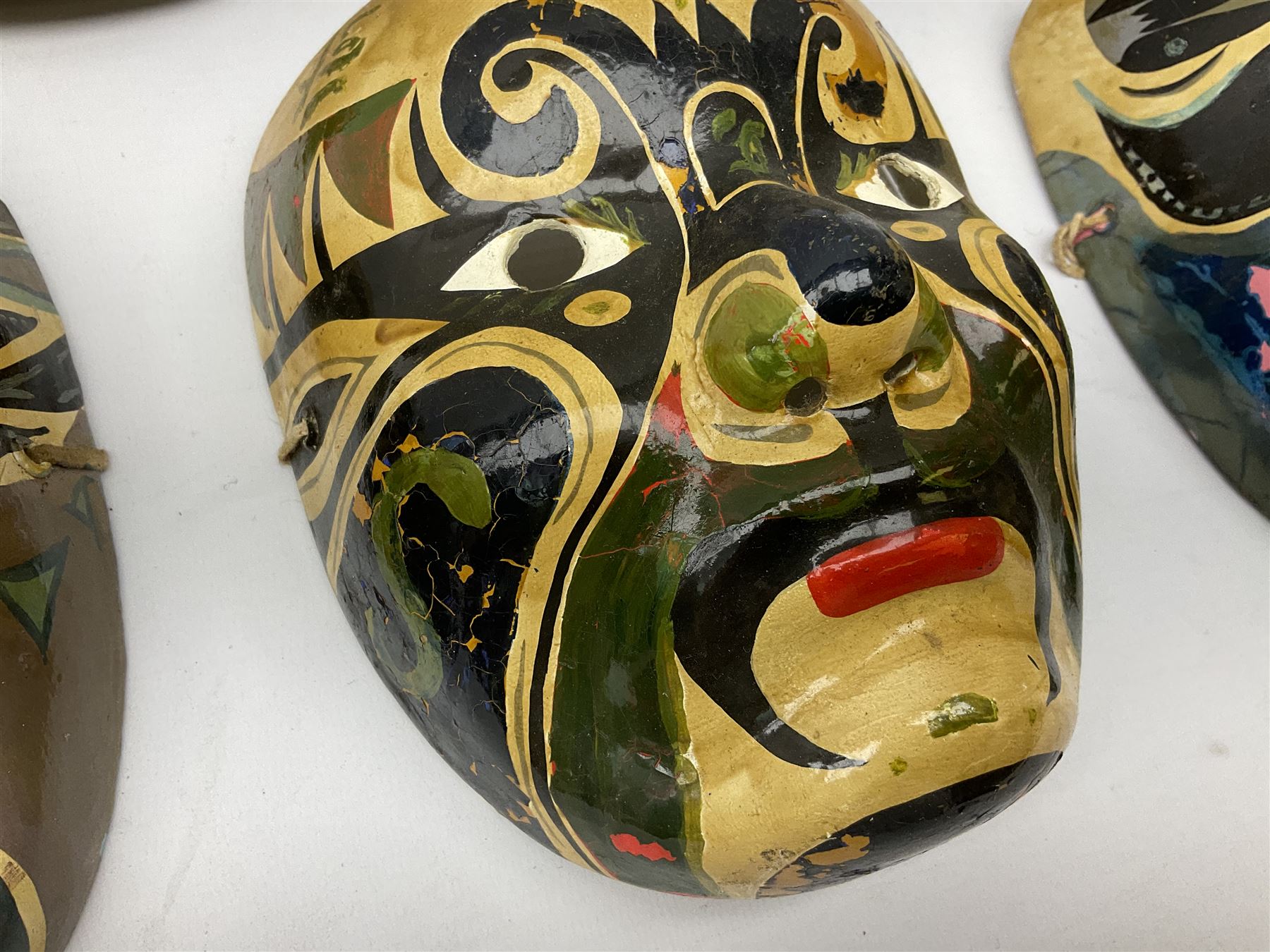 Five Japanese theatre / opera masks, the papier-mâché traditionally painted in the Noh Kabuki style, L18cm