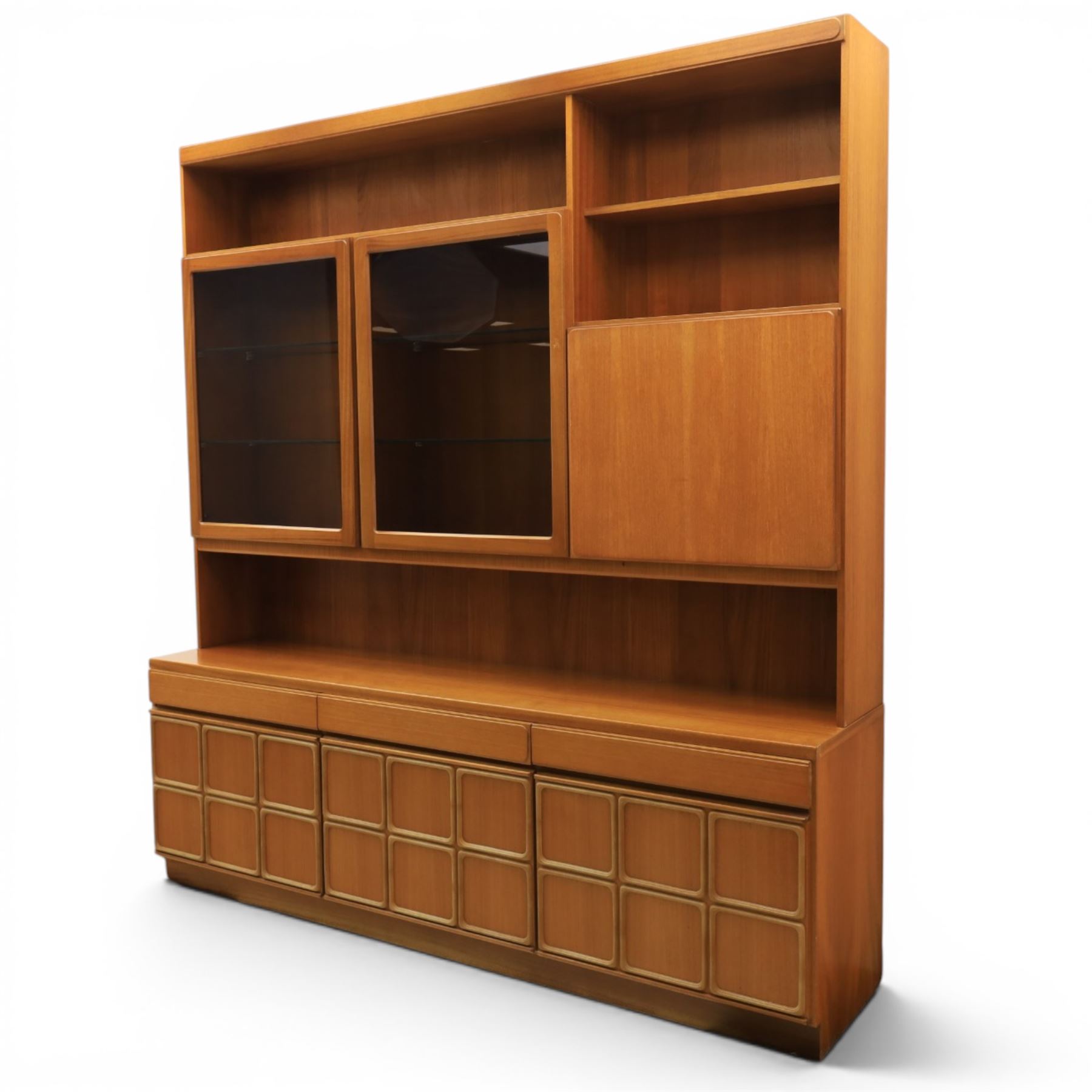 McIntosh Furniture - mid-20th century teak highboard unit, two glazed cupboards enclosing a glass shelved interior, a fall front cabinet to the other side mirrored back, with three frieze drawers one fitted for cutlery, with applied square panels