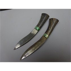  Gurkha Kukri knife, 31cm shaped steel blade with horn handle, in steel tipped black leather scabbard with two smaller knives and frog, L47cm. Provenance The vendors Father left Gilgit in 1947   