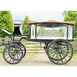 Victorian Glass Hearse

A black painted four wheeled horse drawn glass hearse with exten...