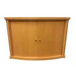 Beech bow-front sideboard, fitted with two cupboard doors enclosing two shelves