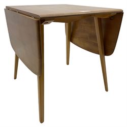Ercol - elm and beech dining table, rectangular drop-leaf top on splayed square tapering supports 