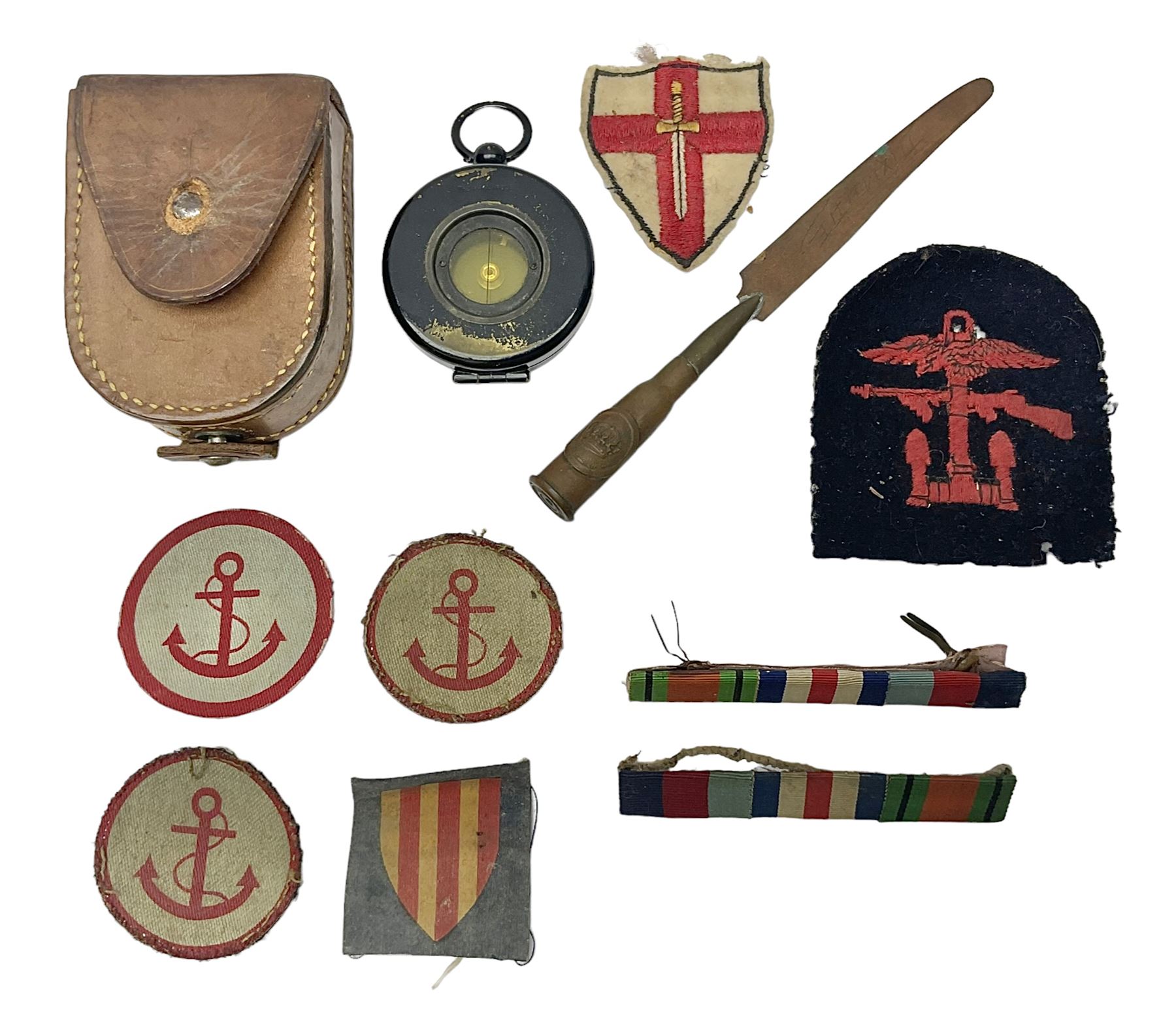 WW1 Short & Mason Ltd 'The Magnapole' black japanned brass field compass in leather carrying case; WW1 trench art paper knife inscribed Dixmude; and small quantity of cloth badges etc