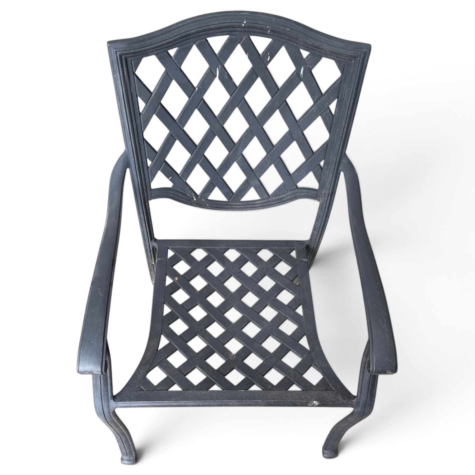 Grey-painted cast metal garden dining suite, comprising circular latticework table on splayed supports (W152cm H72cm), and six matching open armchairs with lattice backs and seats (W61cm H93cm)
