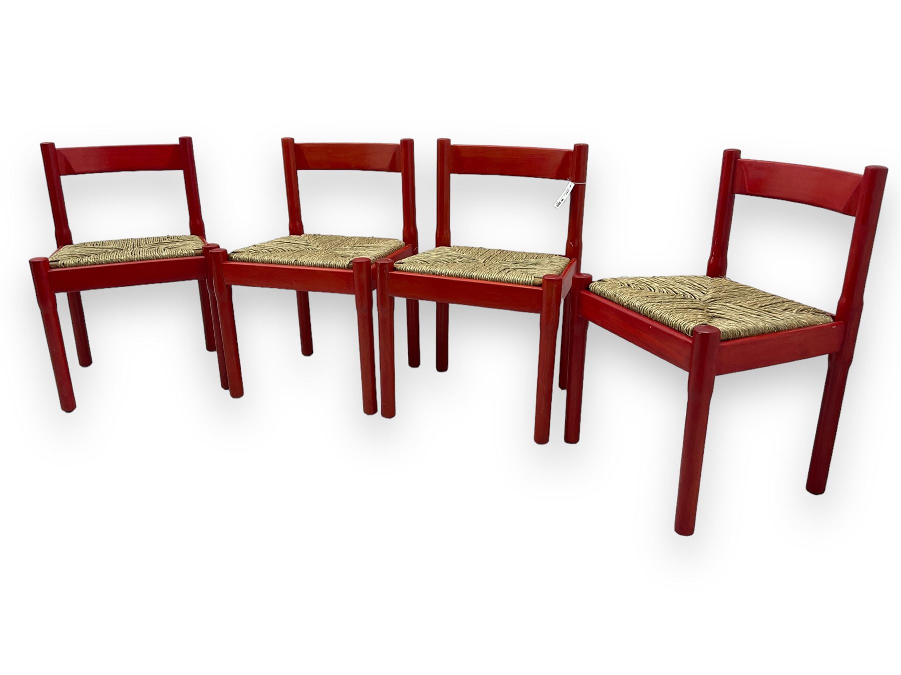 Vico Magistretti - mid-20th century circa. 1970s set of four beech framed dining chairs in red finish, with drop-in rush seats