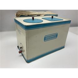 Six toy kitchen appliances - Casdon battery operated cooker; Mettoy Hoover washer; Chad Valley Hoovermatic washer; Wells Brimtoy tin-plate clockwork washer; and two Morphy Richards irons; together with a continental child's Regina sewing machine; all boxed (7)