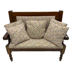 Polished pine bench seat, upholstered in multi-coloured patterned fabric