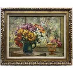 St Ives School (Early 20th century): Still Life - Flowers in a Jug, oil on canvas unsigned, with 'James Lanham, Artist's Colourman, St Ives Cornwall' metal label to stretcher 44cm x 60cm