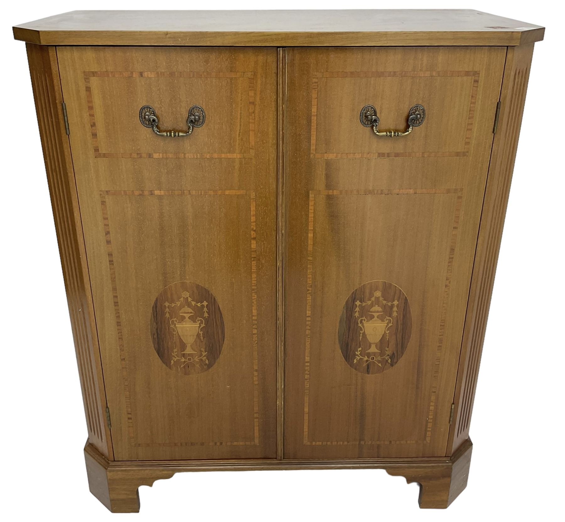 John More of Scarborough -  Edwardian Revival 'Canterbury Cabinet' inlaid mahogany cabinet, fitted with double cupboard decorated with urn motif inlays and banding, flanked by canted fluted uprights, on bracket feet