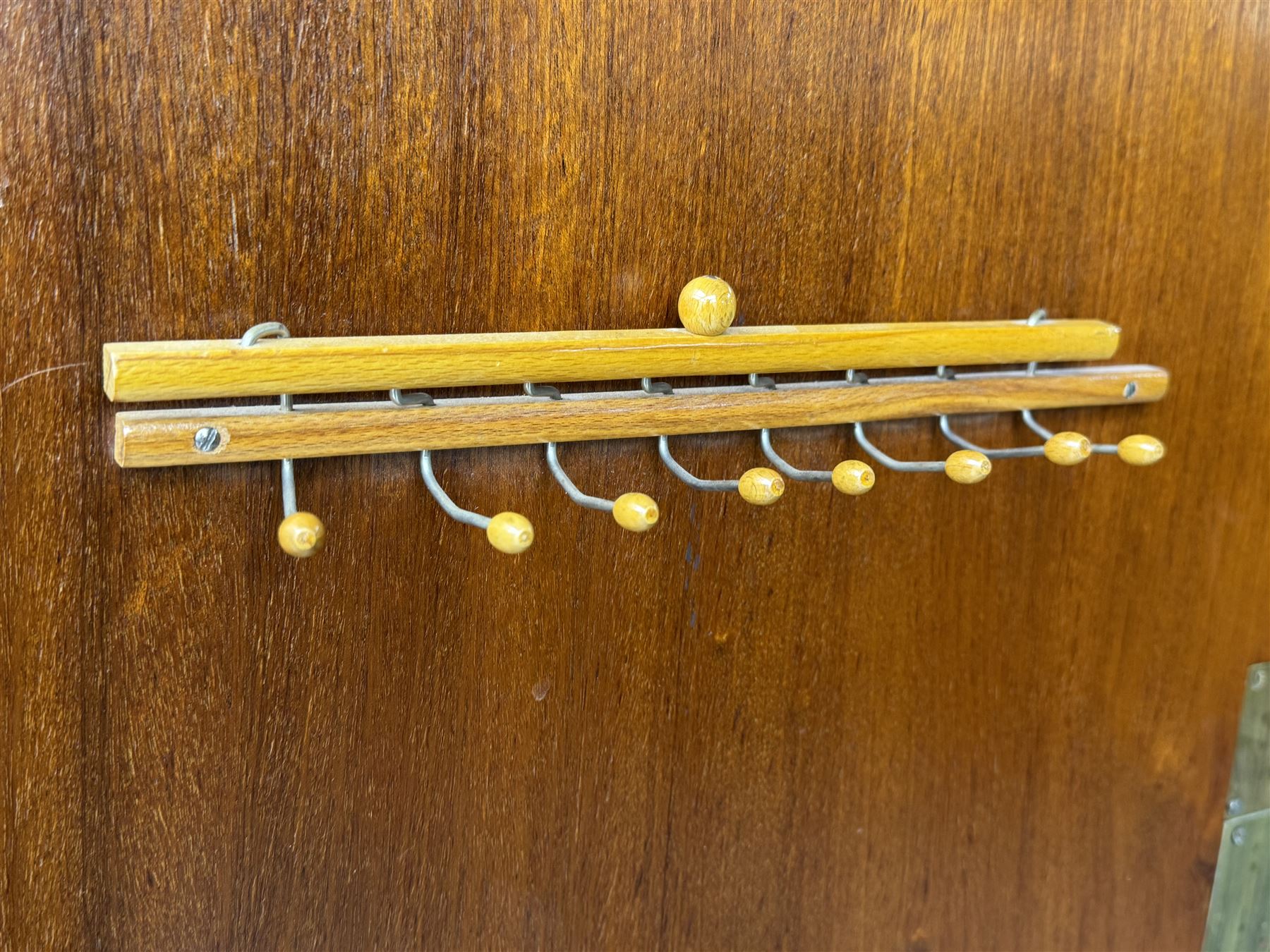 Ashton Leach & Cumberbirch Ltd., Rochdale - early 20th century walnut and mahogany gentleman's wardrobe, arched moulded top with book-matched figured walnut veneers, double doors enclosing fitted interior with hanging rail, tie rack and drawers, raised on cabriole supports