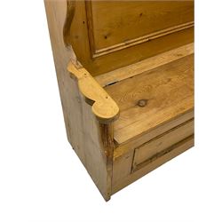 Waxed pine box-seat settle or hall bench, panelled back over hinged seat, shaped end supports