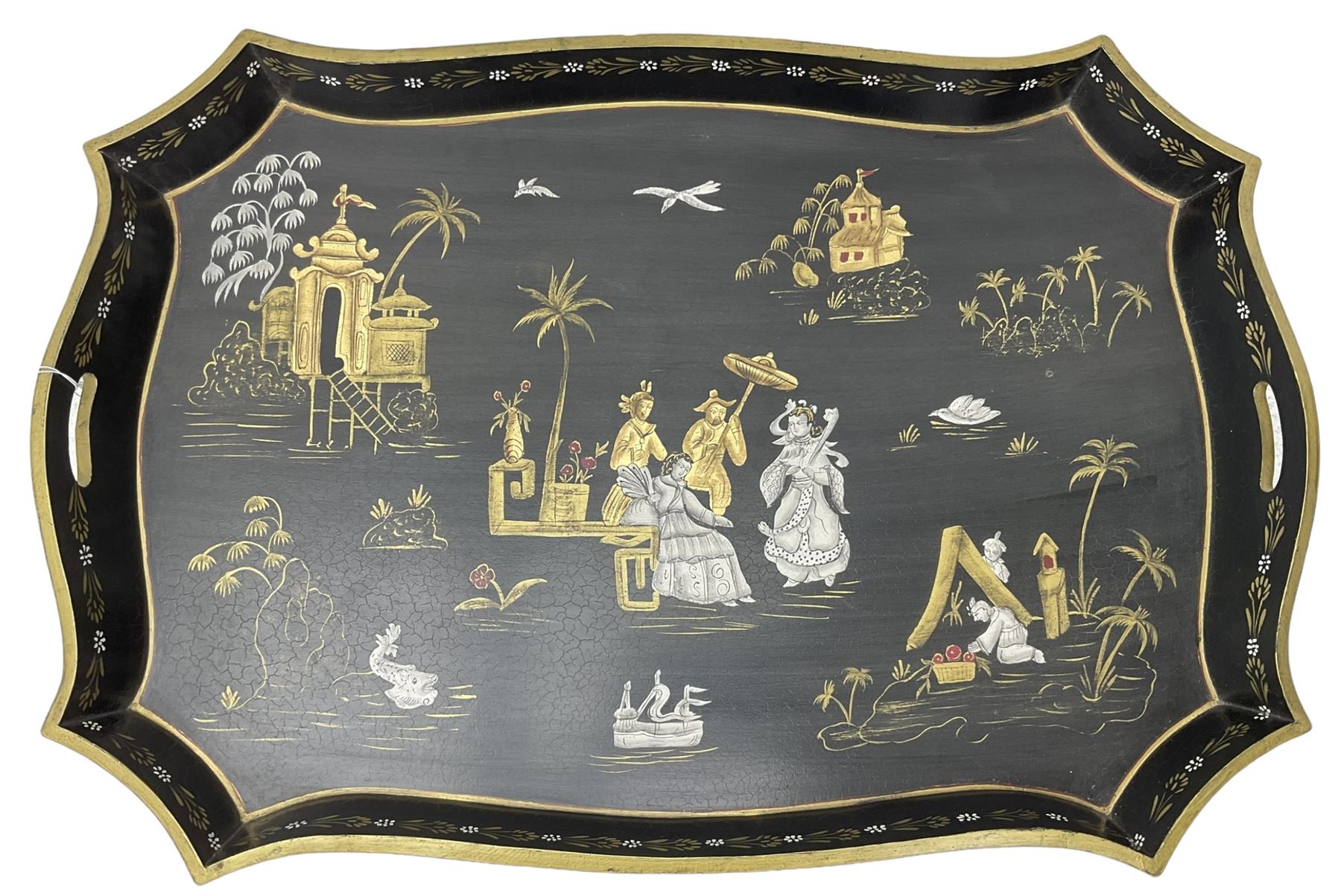 19th century design Chinoiserie style lacquered tray, painted with traditional scenes with figures and pagodas with gilt detail, on a folding simulated bamboo metal stand
