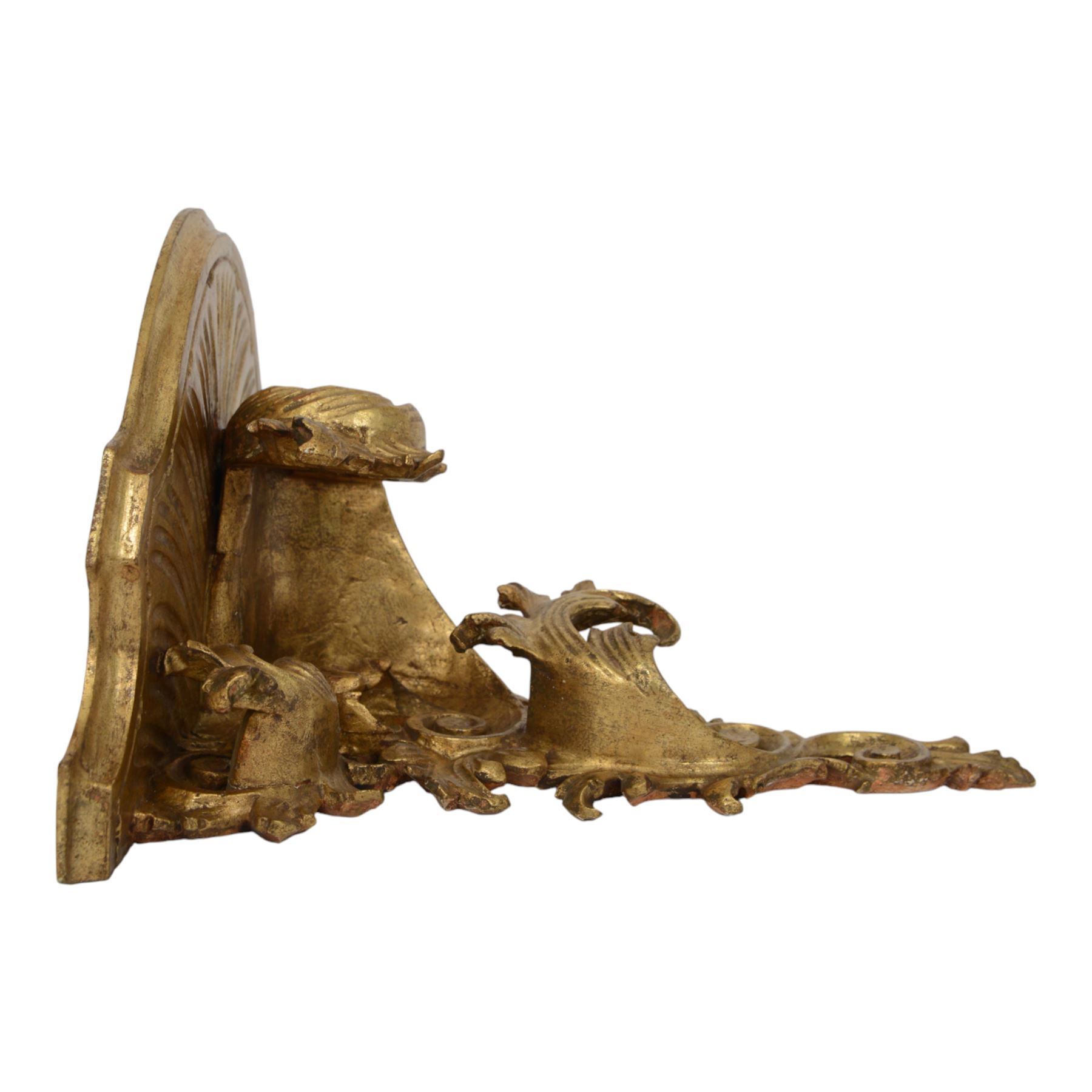 Two 20th century gilt wall brackets, comprising Rococo style carved wooden wall bracket upon a scrolling foliate support and a cast plaster bracket upon Griffin support, largest H38cm