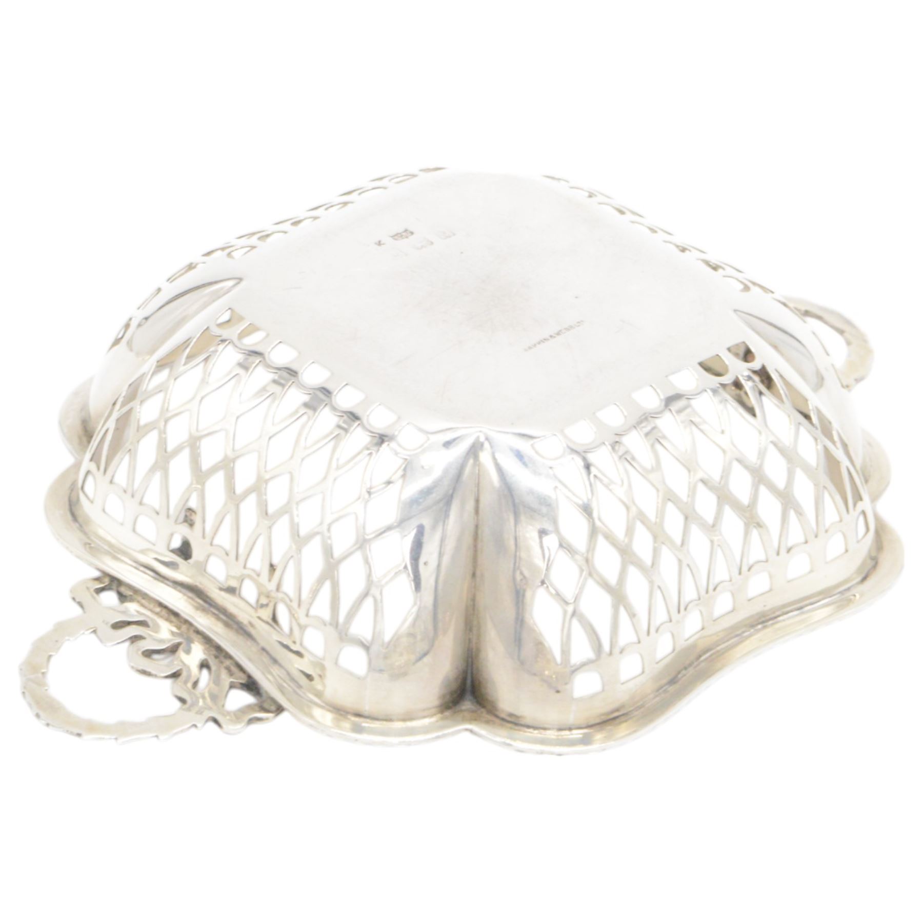 Three mid 20th century silver bowls, including two circular examples with pierced sides and a square example with twin handles, all hallmarked