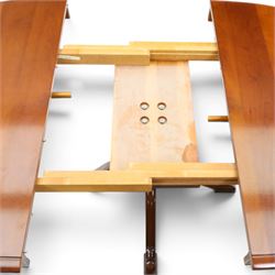 Barker & Stonehouse - cherrywood oval extending dining table and four upholstered chairs, the table with additional leaf extended to cm, raised on a turned column above swept supports, the chairs with brown upholstery and multi-coloured geometric design