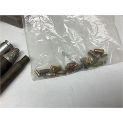 Assorted militaria including ten leather or canvas cartridge and other belts, maroon beret with 17th Lancers cap badge, modern bullet mould, leather and brass shot flask, two knives, shell cases, boomerang etc; in tin deed box