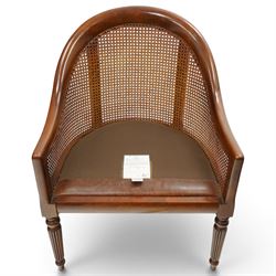 Laura Ashley - pair of bergère tub armchairs with leather seats, raised on fluted and turned supports