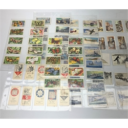 A collection of approximately seventy postcards, to include assorted topographical examples, and Naval and nautical examples, together with approximately one hundred and forty cigarette cards, to include sporting, motor racing, and naval examples. 