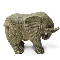 Carved stone Rhino, W44cm and a pair of two green stone Elephants, W38cm (3)