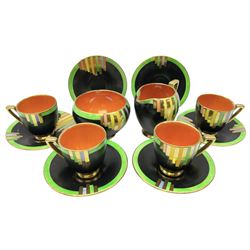 1930s Art Deco Carlton Ware Ziggarette pattern part coffee set, decorated with graduating geometric banding in gilt, blue, yellow, pink and green on matte black ground with orange lustre interiors, comprising four cups, six saucers, cream jug and open sucrier, all with printed marks beneath