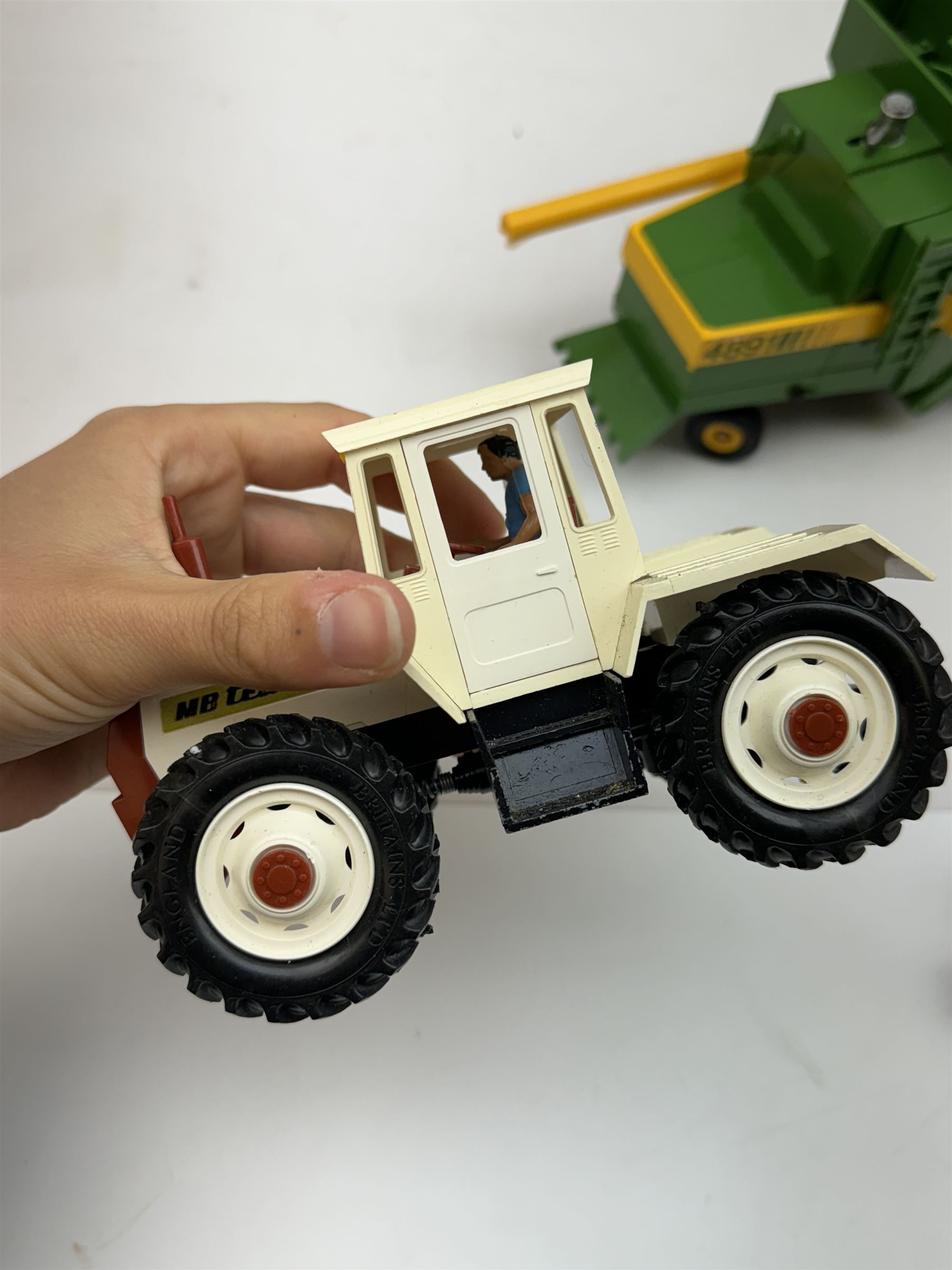 Collection of predominantly late 1970s/early 1980s Britains diecast vehicles and farming equipment, including Corn King, tractors, JCBs, horsebox, skip lorry, etc together with figures and accessories