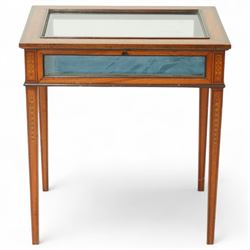 Edwardian satinwood bijouterie table, rectangular glazed top and glazed sides enclosing a blue velvet-lined display well, raised on square tapering legs, decorated throughout with neoclassical foliate inlay