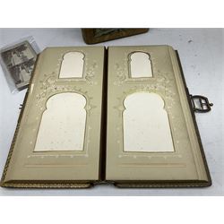 Victorian photograph album with ornately gilded and hand painted covers and brass clasp, partially stocked with Victorian and later portraits etc; another well stocked Victorian leather bound photograph album relating to the Cawood family; three other Victorian leather bound photograph albums; and small quantity of stereoscopic cards