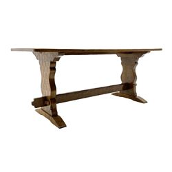 ‘Gnomeman’ oak dining table, rectangular adzed top, shaped end supports on sledge feet joined by pegged stretcher, carved with gnome signature, by Thomas Whittaker of Littlebeck
