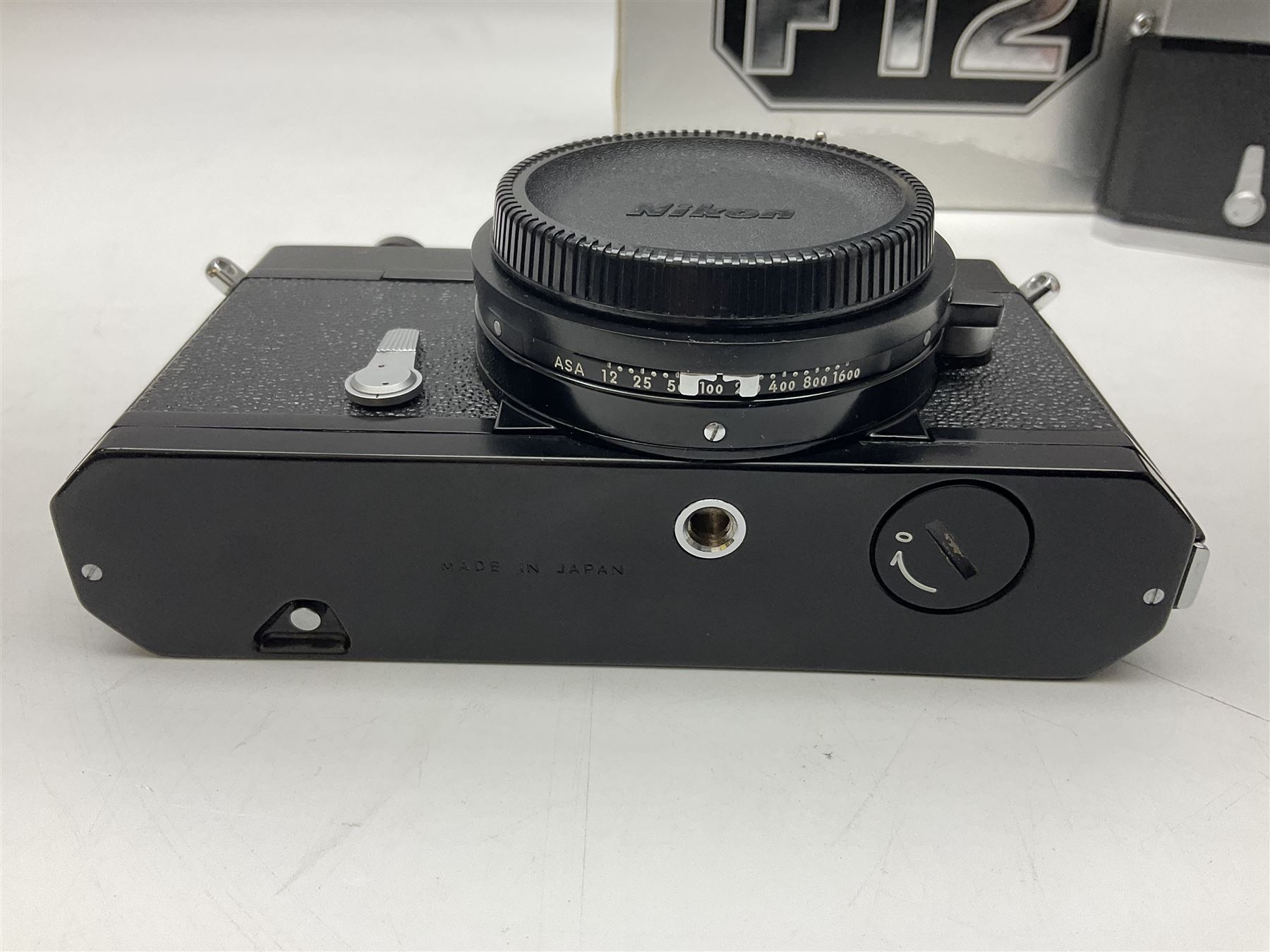 Nikkormat FT2 camera body, serial no. 5066813, in original packaging, together with Nikkormat EL camera body, serial no. 5577358, with Nikon Nikkor 50mm 1:1.8' lens no. 2143575, Nikkormat FT, serial no. 3968385, and Nikomat FT camera body, serial no. 4015491