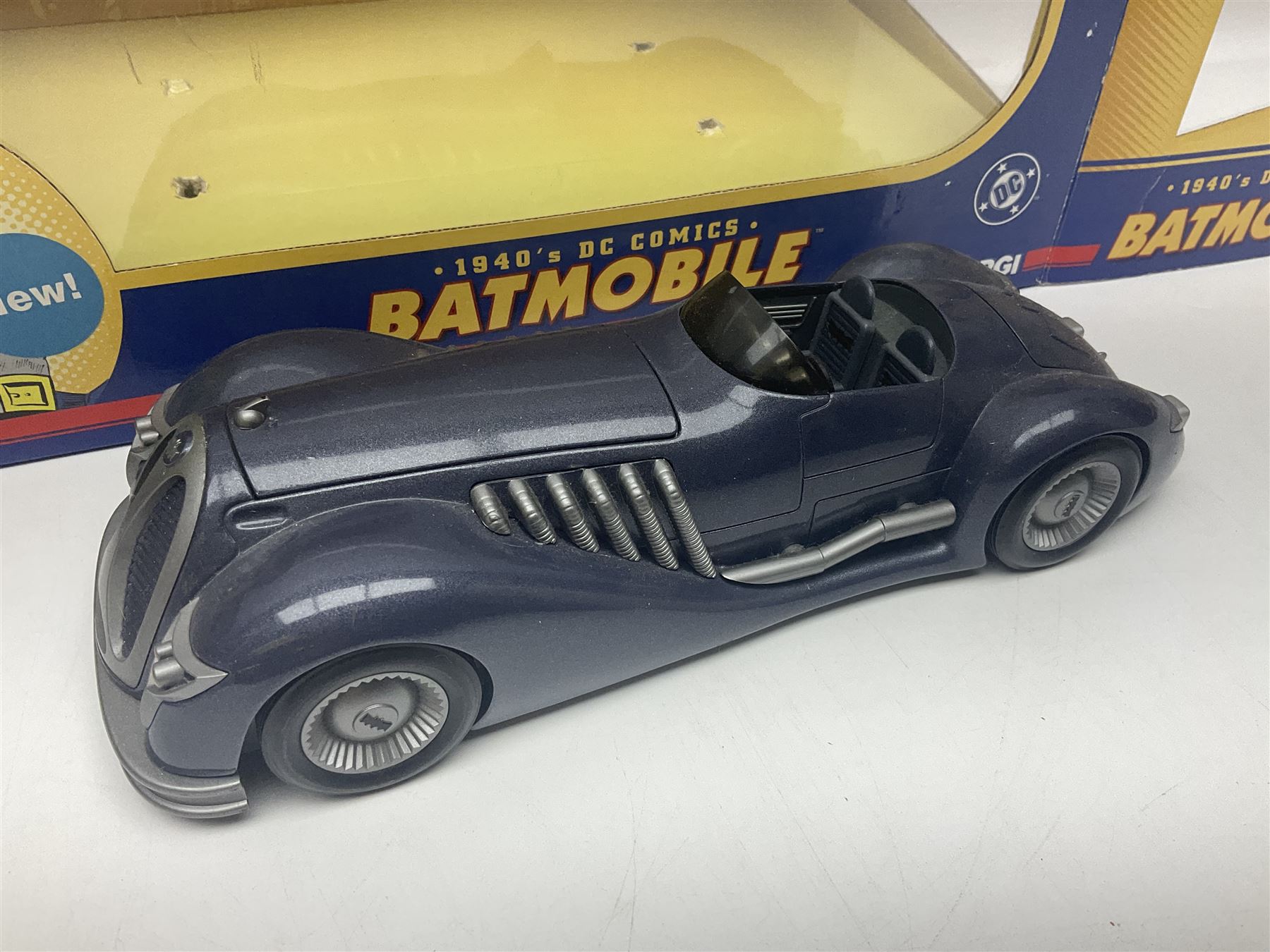 Five Corgi Batmobile die-cast vehicles from the DC Comics collection, to include 1940’s DC Comics BMBV2 1:18 and BMBV1 1:24 scale Batmobiles, all in original boxes 