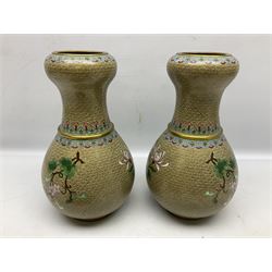 Pair of Chinese cloisonne baluster vases, decorated with decorated with butterflies, flowers, together with a cloisonné bowl decorated with five clawed dragons and the flaming pearls 