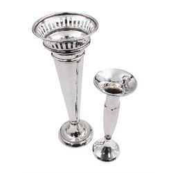 Two early 20th century silver vases, the first example of trumpet form, with faceted knopped stem, upon spreading filled foot, H18.5cm, hallmarked W G Sothers Ltd, Birmingham 1923, the second example of plain tapering form, with beaded and pierced rim, upon conforming stepped filled foot, H25.5cm, hallmarked Birmingham 1938, maker's mark worn and indistinct
