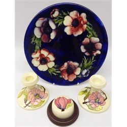  Moorcroft Anenome pattern plate, D26cm, pair Magnolia pattern candlesticks & paperweight (4)  